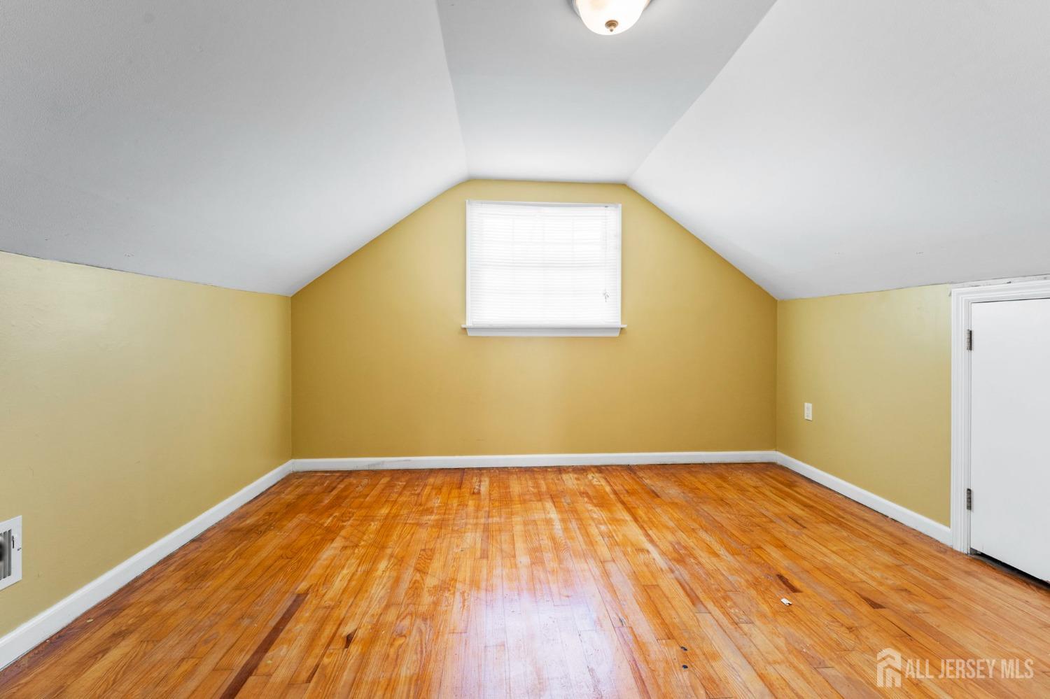 23 Alton Road Hamilton, NJ 08619 - Photo 31 of 40 an empty room with wooden floor and windows
