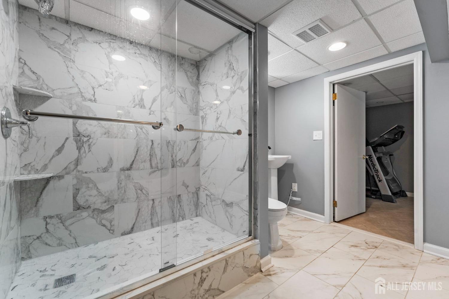 23 Alton Road Hamilton, NJ 08619 - Photo 36 of 40 a bathroom with a bathtub and a shower