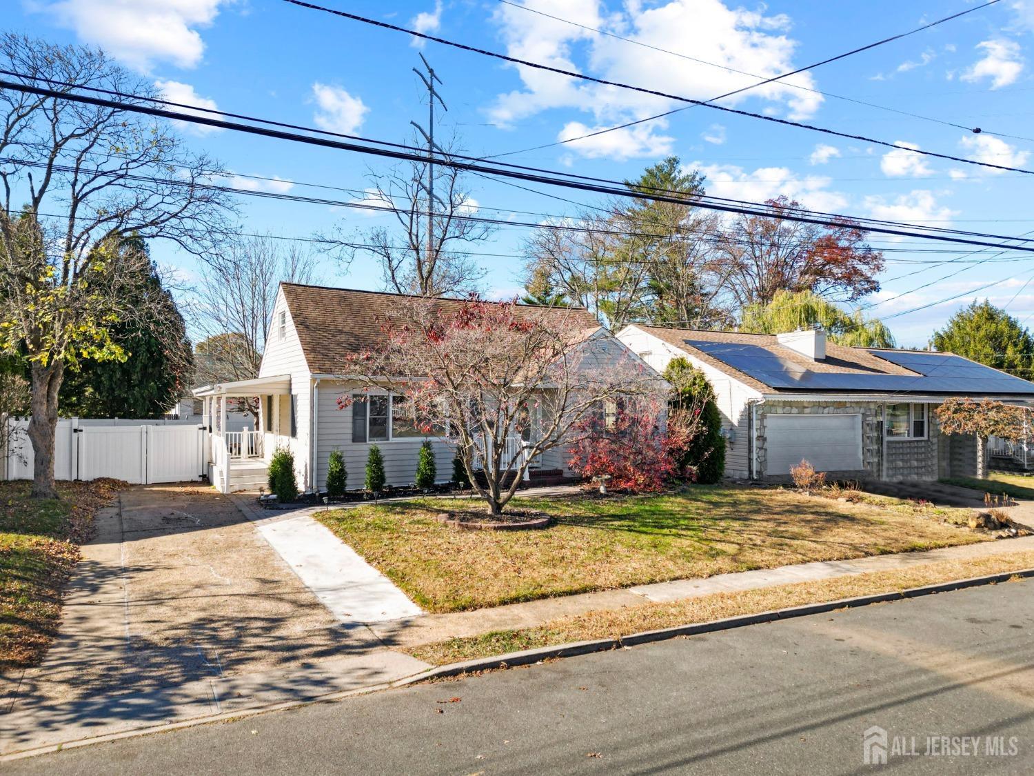 23 Alton Road Hamilton, NJ 08619 - Photo 4 of 40 a view of a house with a yard and garage