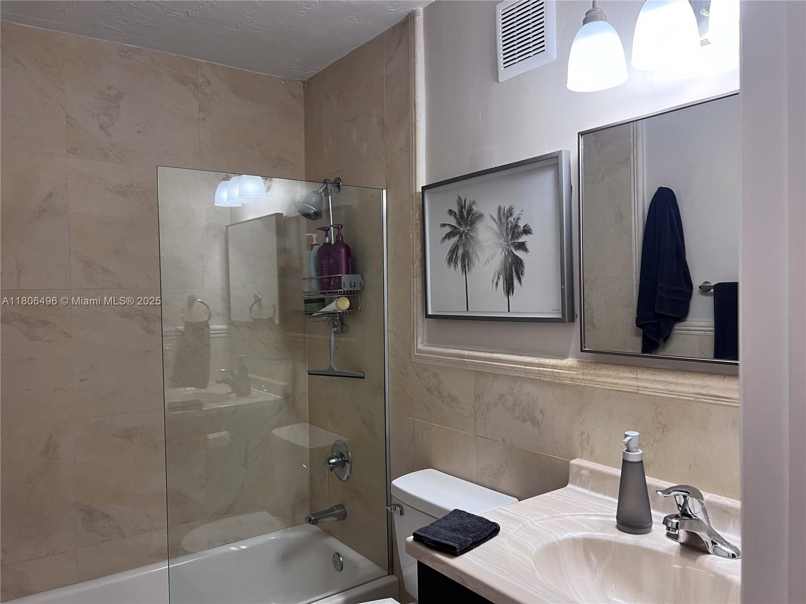 4530 Southwest 68th Ct Circle, Unit 316 Miami, FL 33155 - Photo 11 of 26 a bathroom with a sink and a bathtub