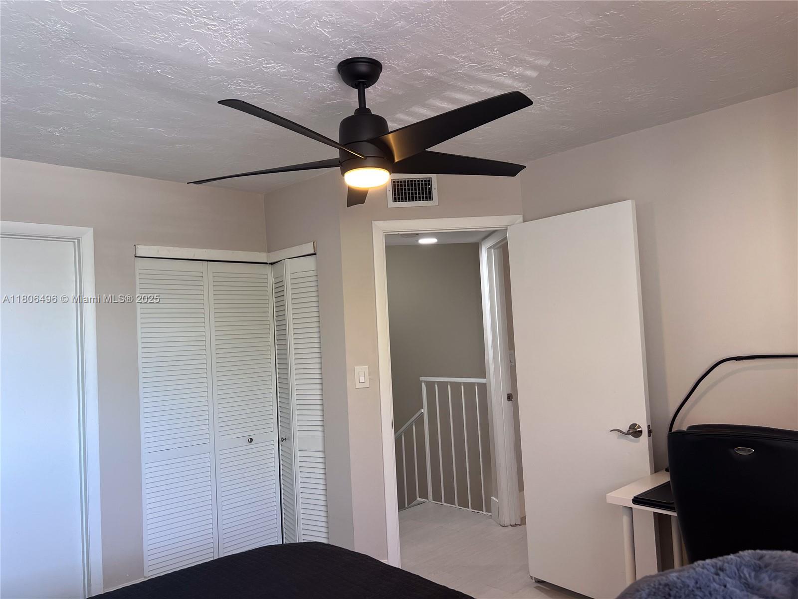 4530 Southwest 68th Ct Circle, Unit 316 Miami, FL 33155 - Photo 17 of 26 a view of a hallway with a chandelier fan