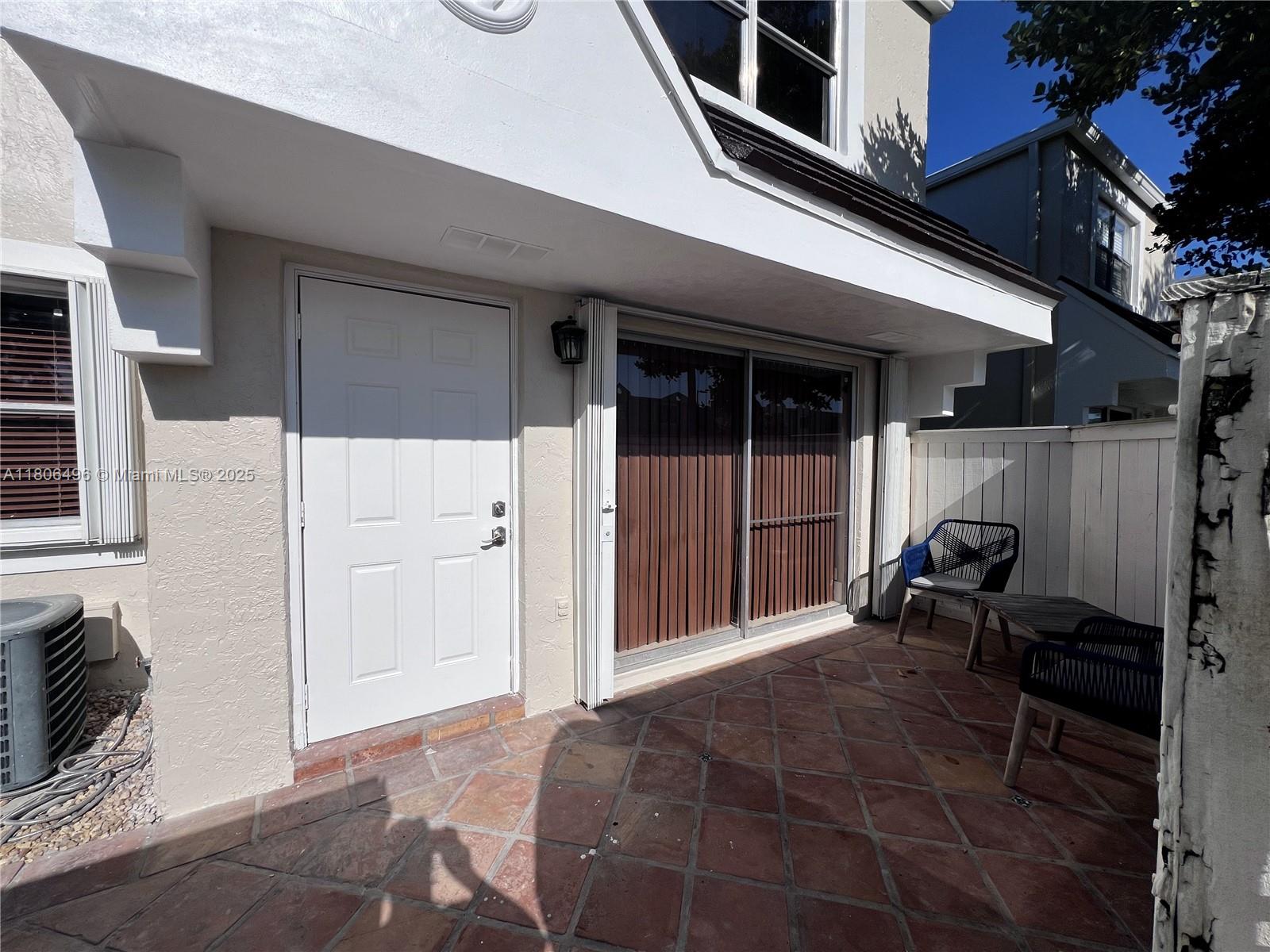 4530 Southwest 68th Ct Circle, Unit 316 Miami, FL 33155 - Photo 24 of 26 a backyard view of a house