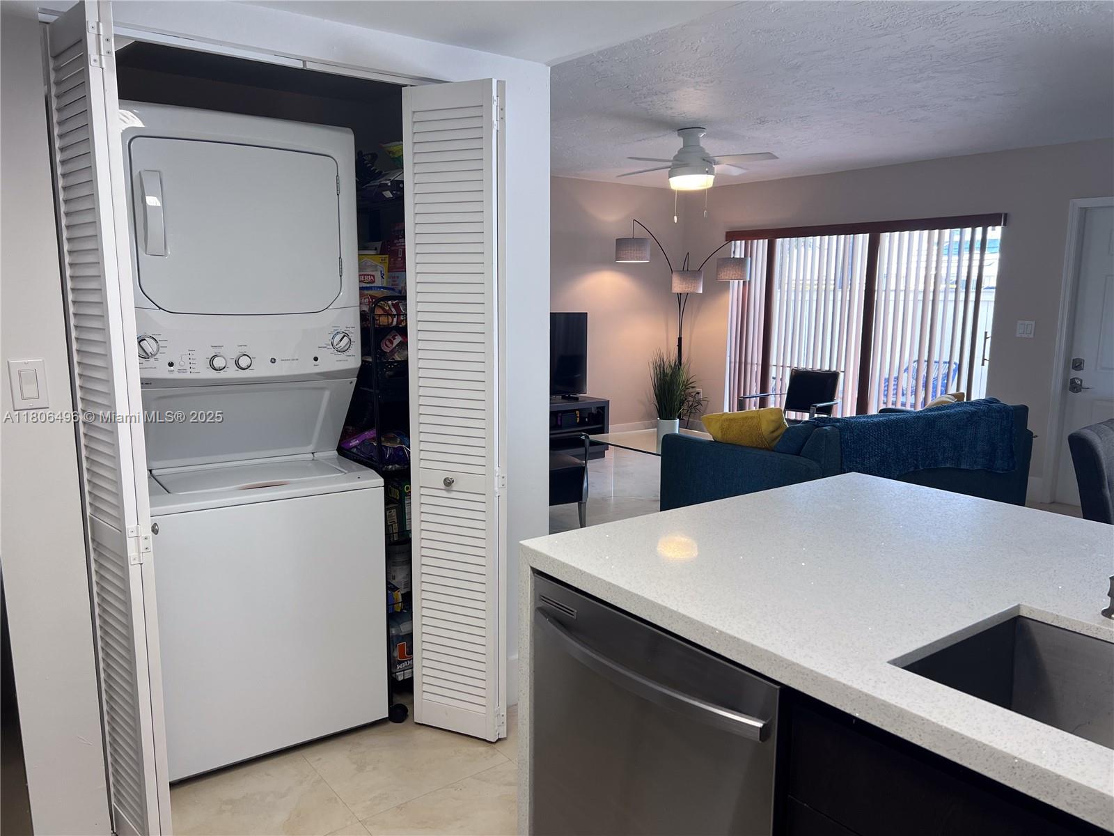 4530 Southwest 68th Ct Circle, Unit 316 Miami, FL 33155 - Photo 10 of 26 a view of kitchen island with cabinets and wooden floor