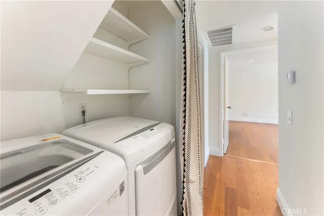 a bedroom with a bed and a cabinets