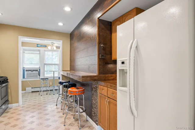 a spacious bathroom with a granite countertop sink and a mirror