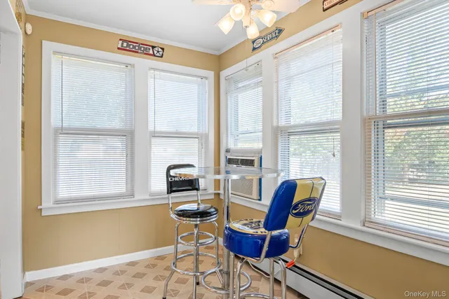 a work room with furniture and a window