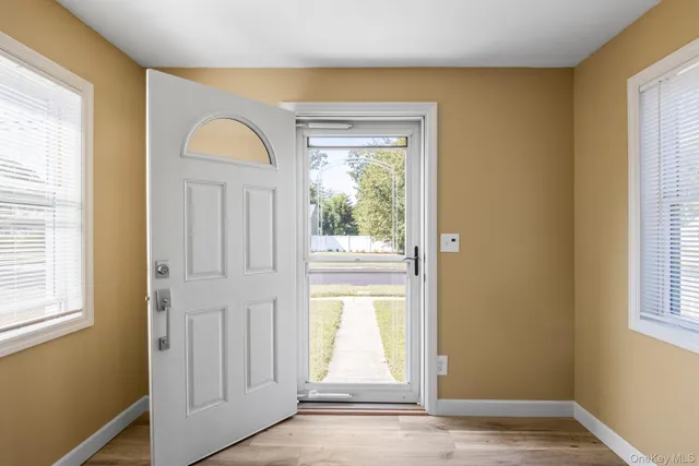 a view of empty room with windows