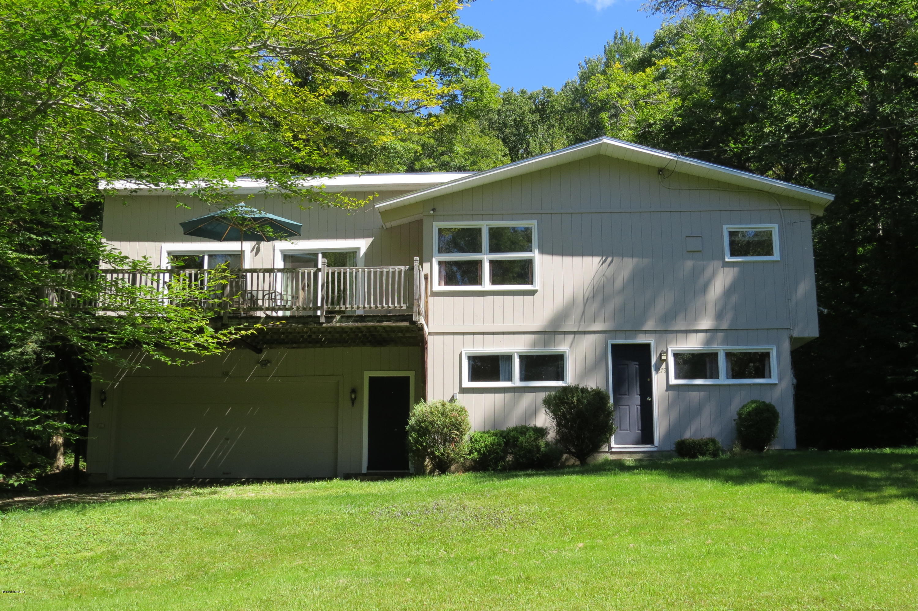 279 Heartwellville View Road Readsboro, VT 05350 - Photo 2 of 42 a front view of a house with a garden and trees