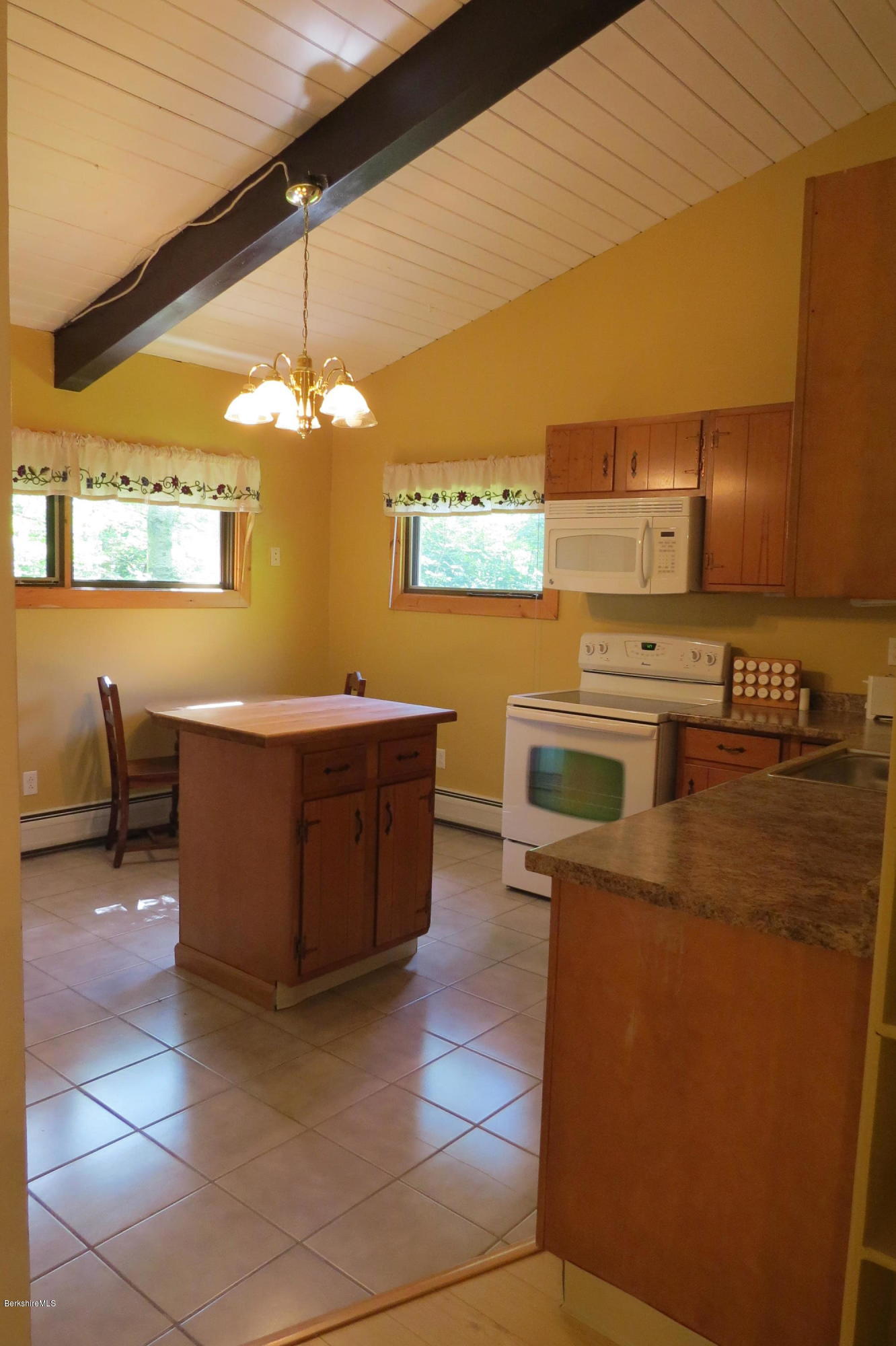279 Heartwellville View Road Readsboro, VT 05350 - Photo 12 of 42 a kitchen with stainless steel appliances granite countertop a sink and a stove