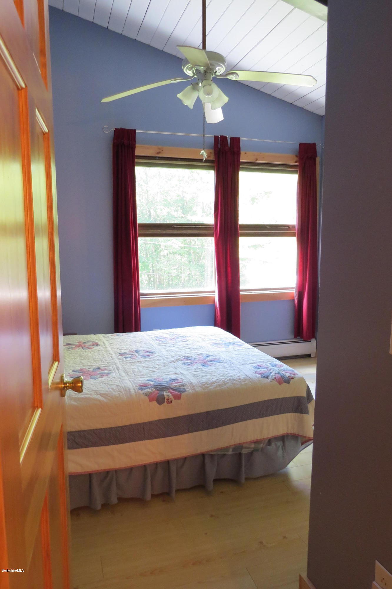 279 Heartwellville View Road Readsboro, VT 05350 - Photo 17 of 42 a bed sitting in a bedroom next to a window