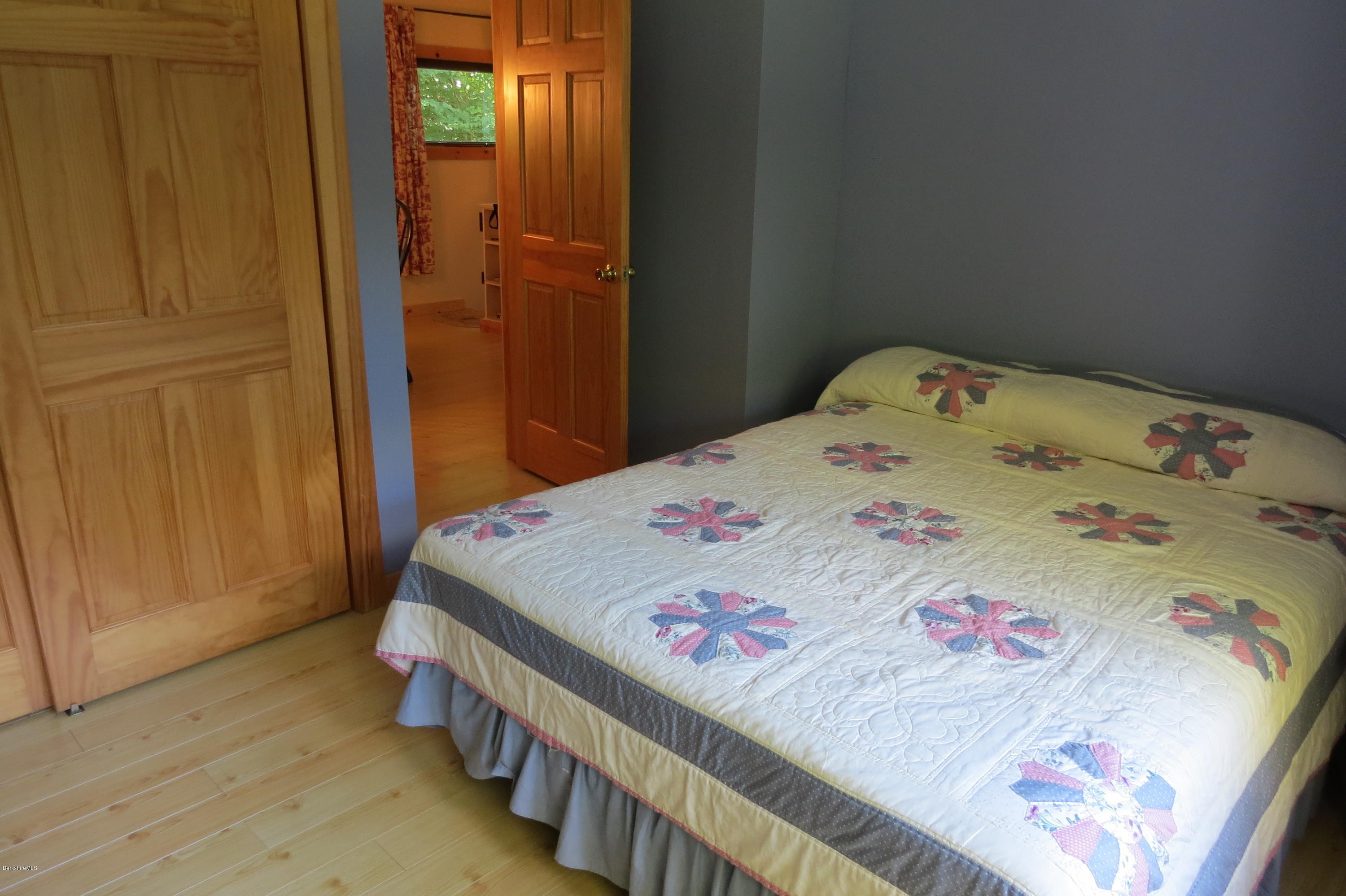 279 Heartwellville View Road Readsboro, VT 05350 - Photo 19 of 42 a bedroom with a bed and a dresser