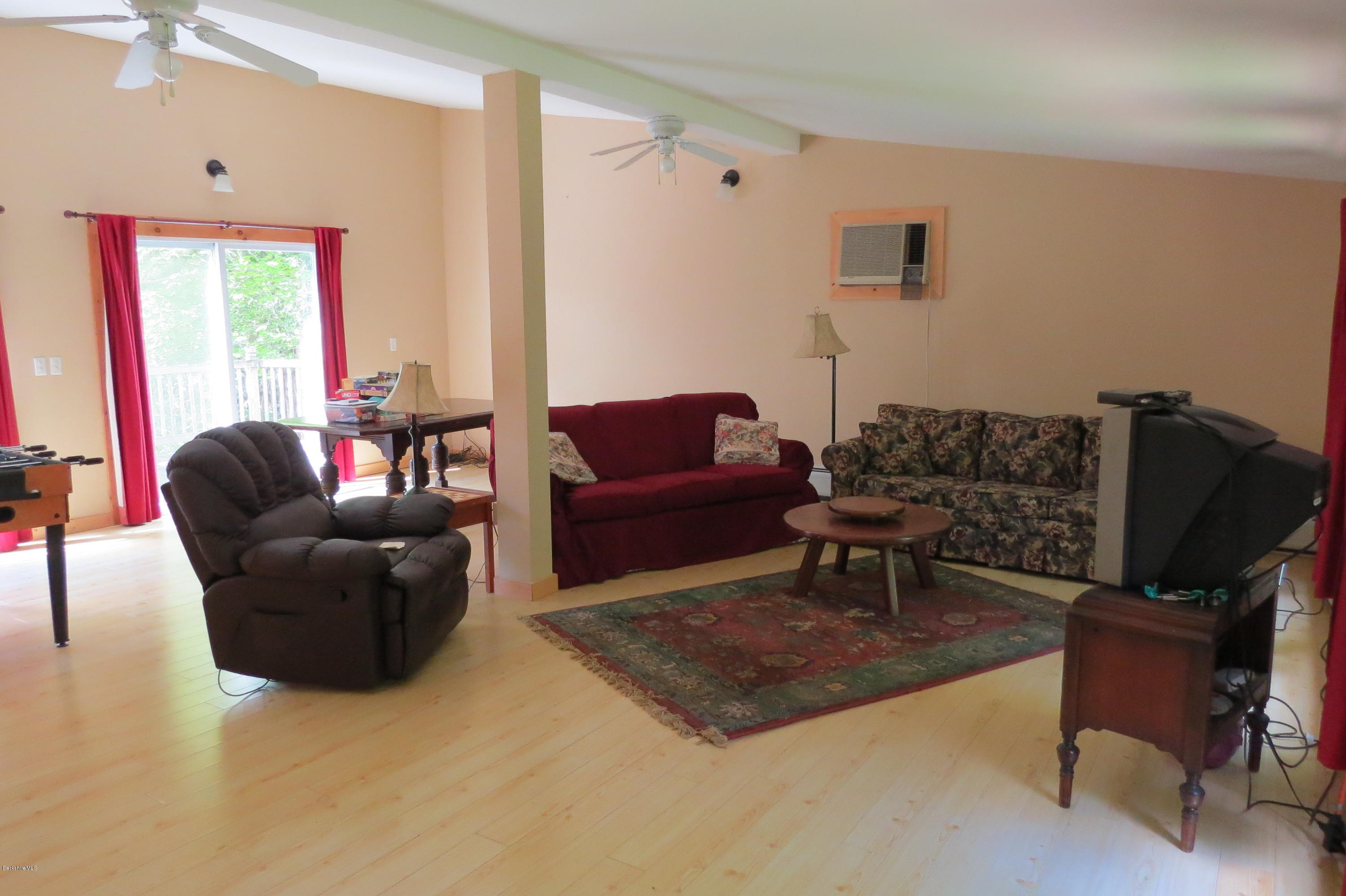 279 Heartwellville View Road Readsboro, VT 05350 - Photo 20 of 42 a living room with furniture and a flat screen tv