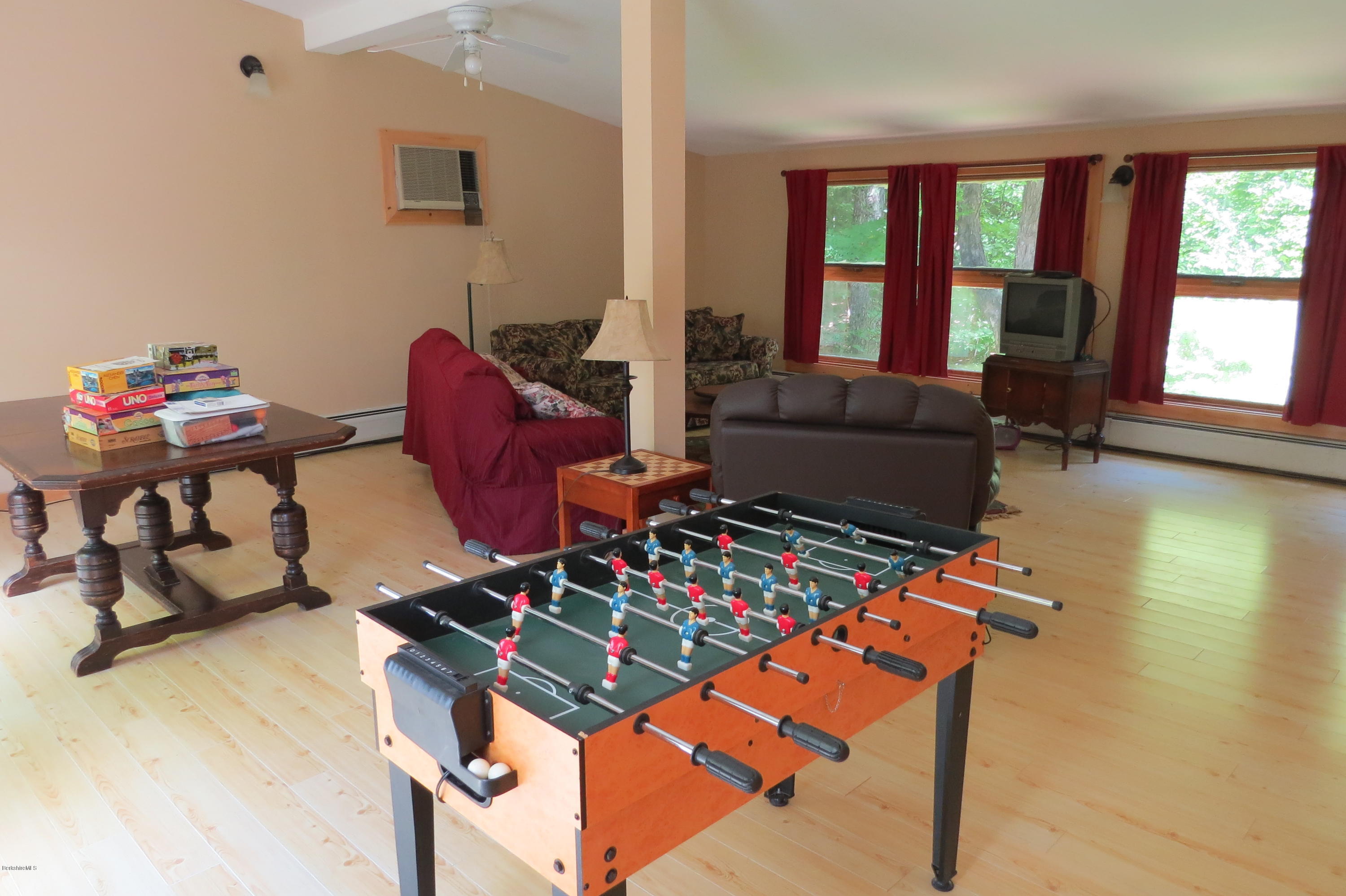 279 Heartwellville View Road Readsboro, VT 05350 - Photo 24 of 42 a living room with furniture and a table