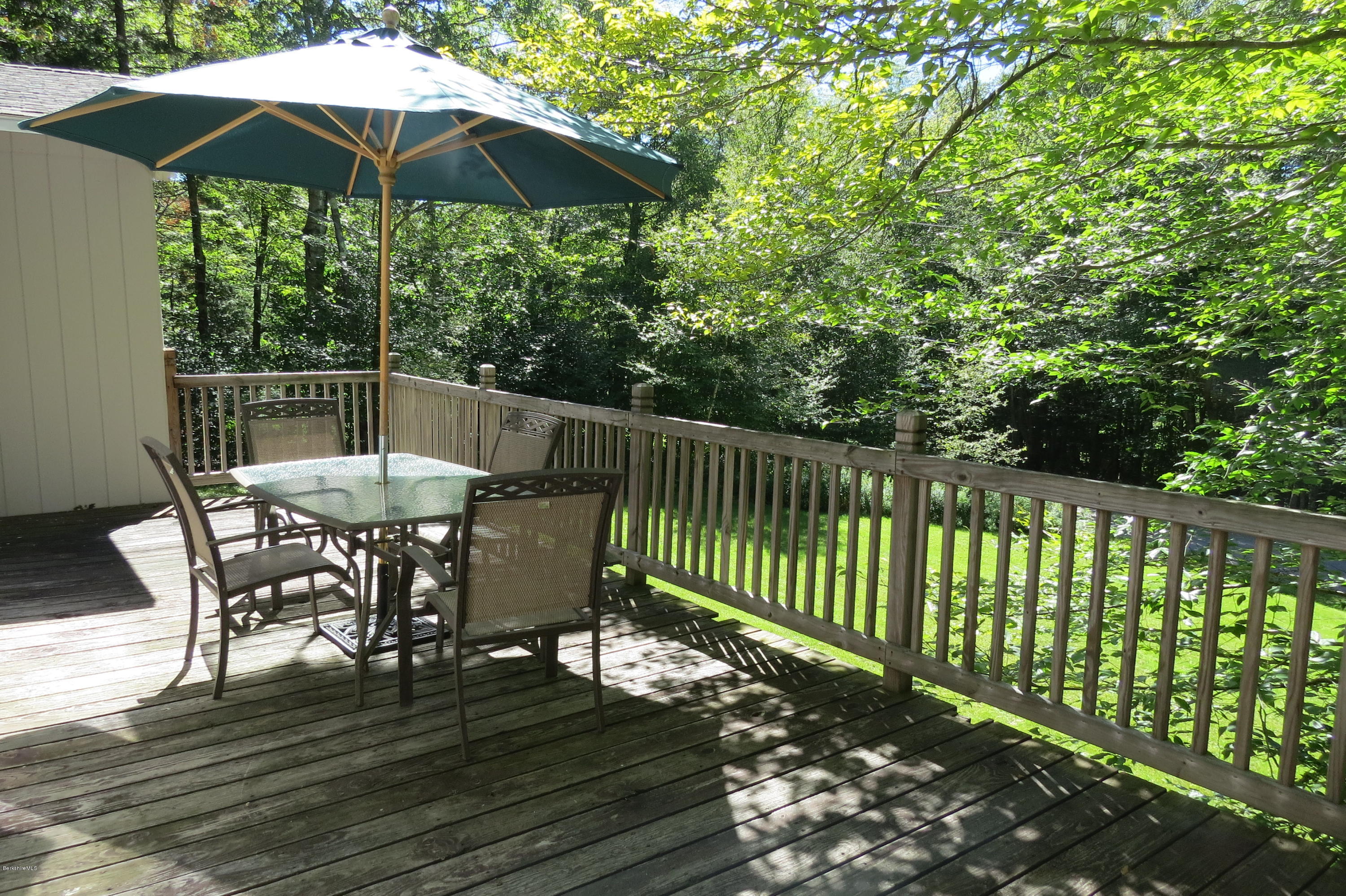 279 Heartwellville View Road Readsboro, VT 05350 - Photo 25 of 42 a view of balcony with wooden floor yard and umbrella