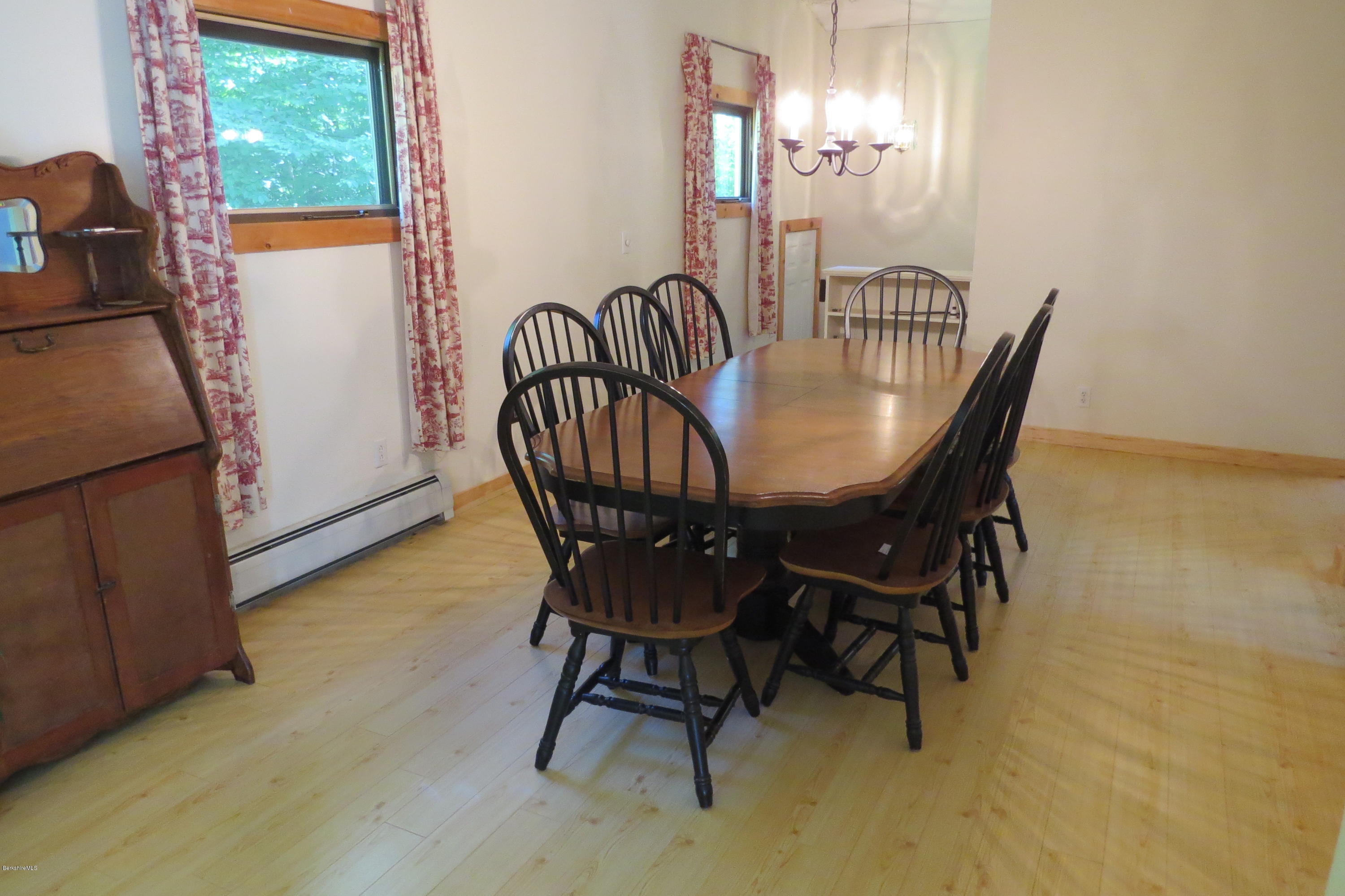 279 Heartwellville View Road Readsboro, VT 05350 - Photo 27 of 42 a view of a dining room with furniture and chandelier