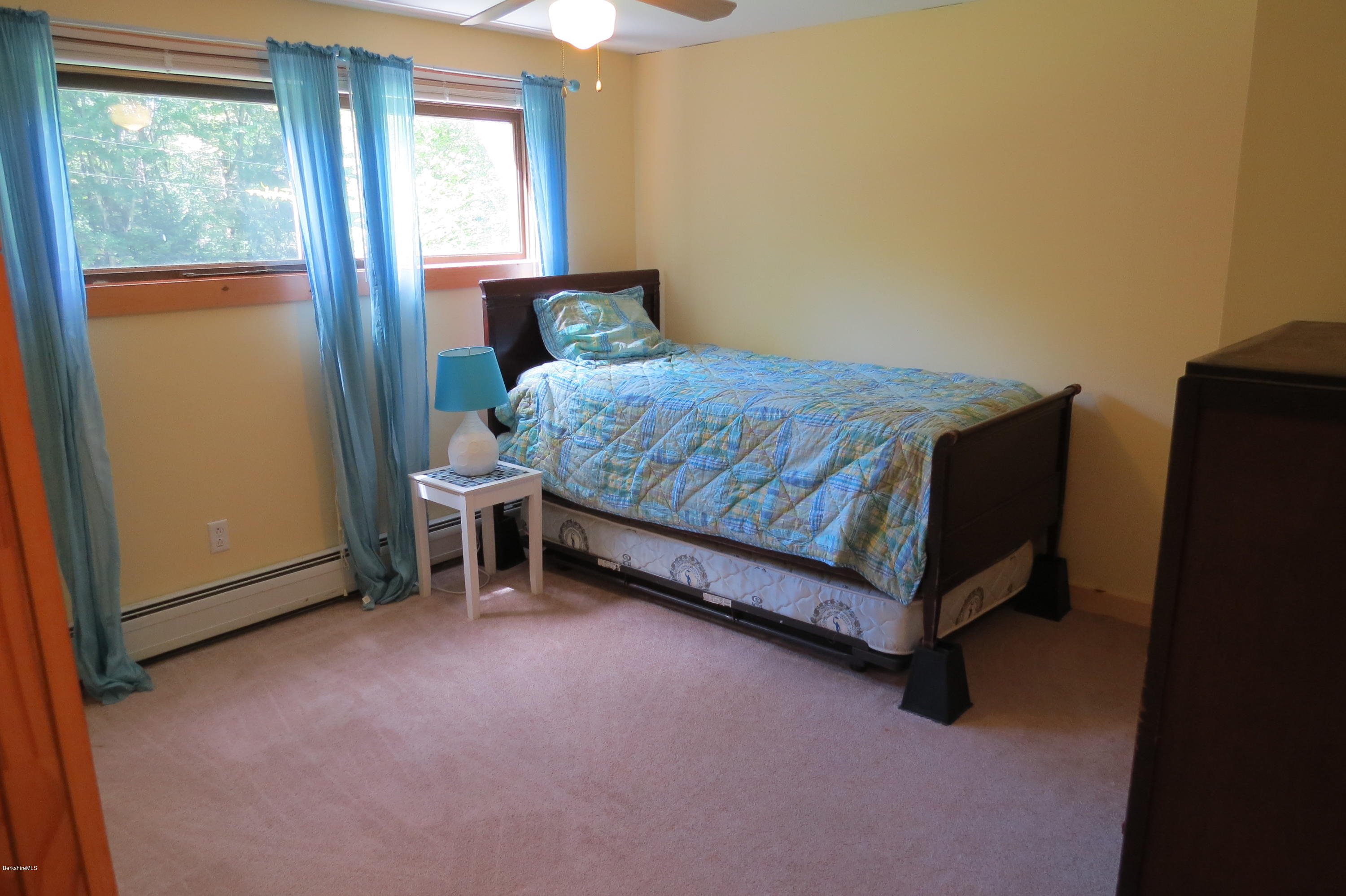 279 Heartwellville View Road Readsboro, VT 05350 - Photo 30 of 42 a bedroom with a bed and a window