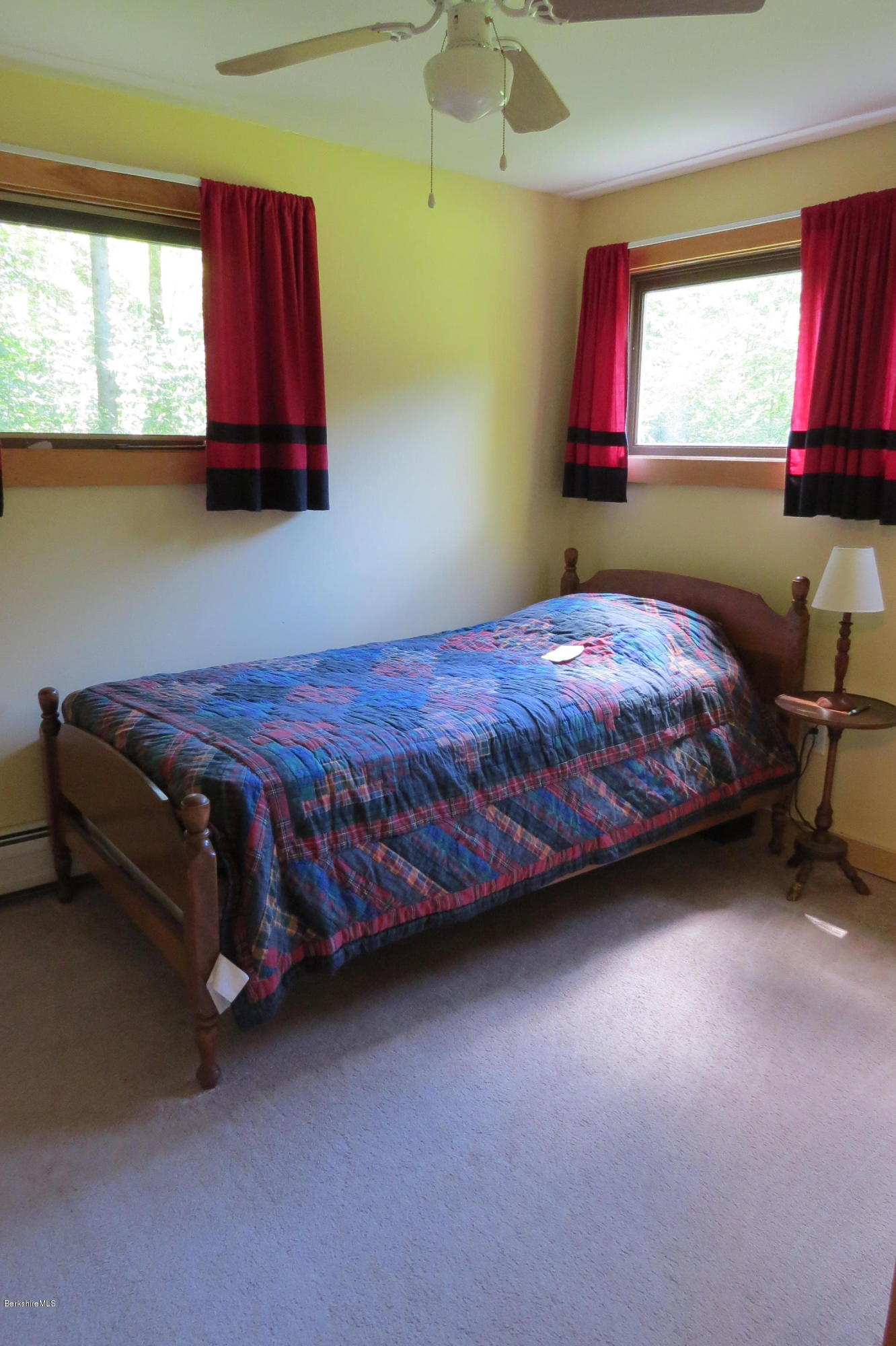 279 Heartwellville View Road Readsboro, VT 05350 - Photo 31 of 42 a bedroom with a bed and window