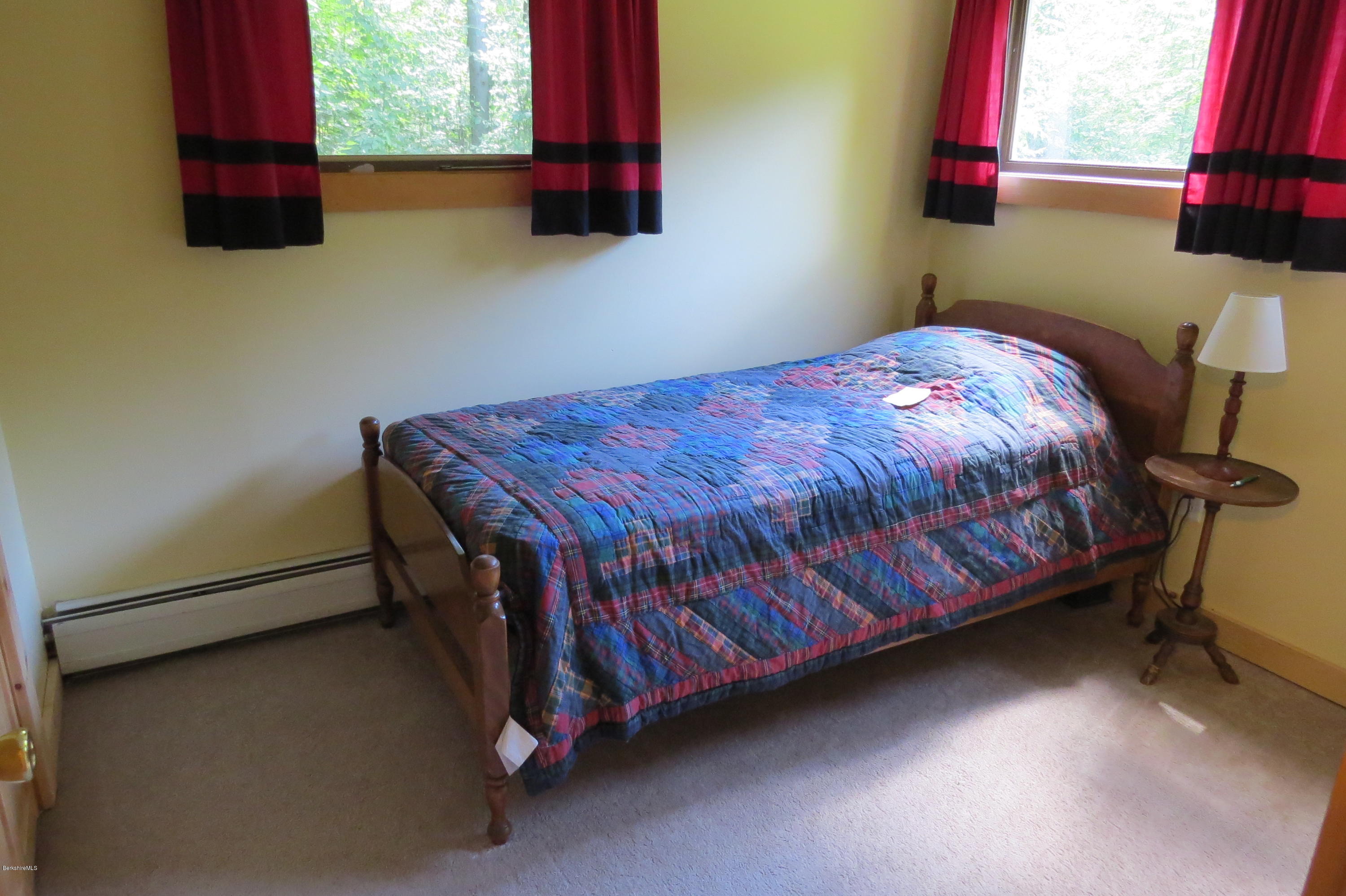 279 Heartwellville View Road Readsboro, VT 05350 - Photo 32 of 42 a bedroom with a bed and window