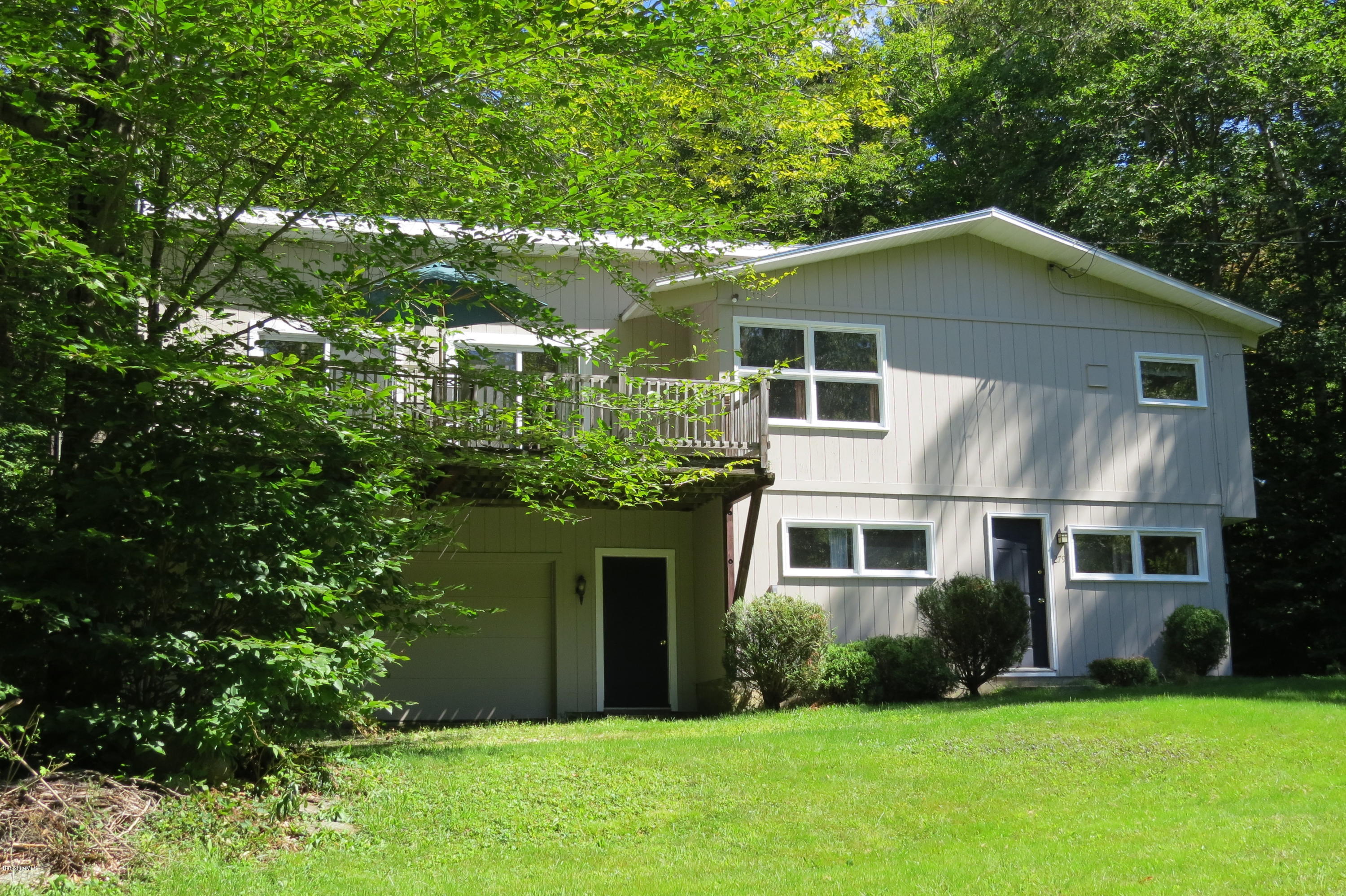 279 Heartwellville View Road Readsboro, VT 05350 - Photo 42 of 42 a front view of a house with a yard and garage