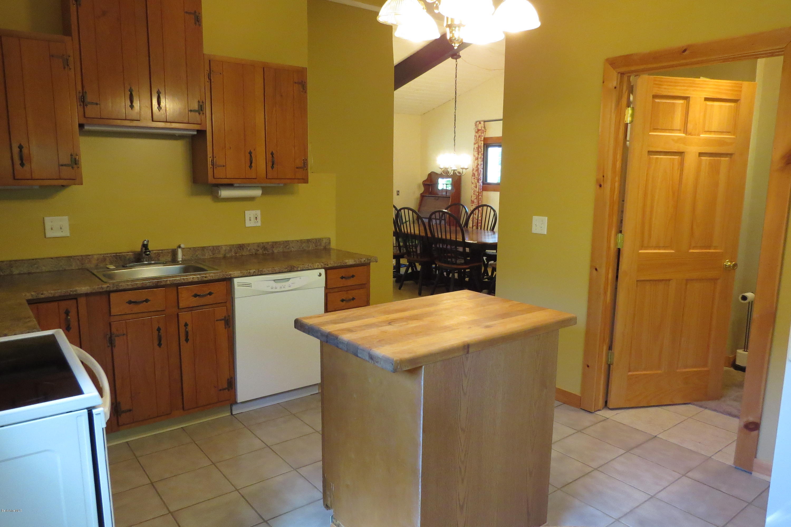 279 Heartwellville View Road Readsboro, VT 05350 - Photo 6 of 42 a kitchen with a sink a stove and refrigerator