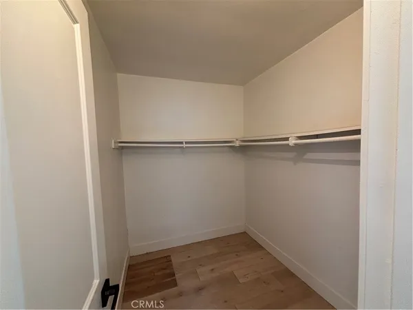 a view of an empty walk in closet