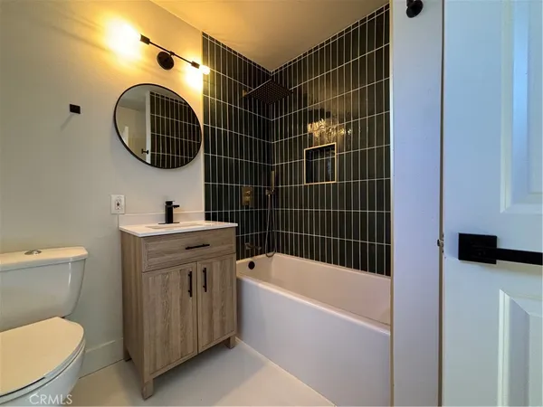 a bathroom with a toilet and a sink