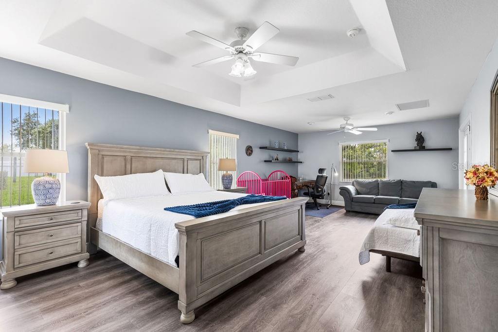 10360 Southwest 48th Avenue Ocala, FL 34476 - Photo 11 of 25 a bedroom with a bed couch and a window