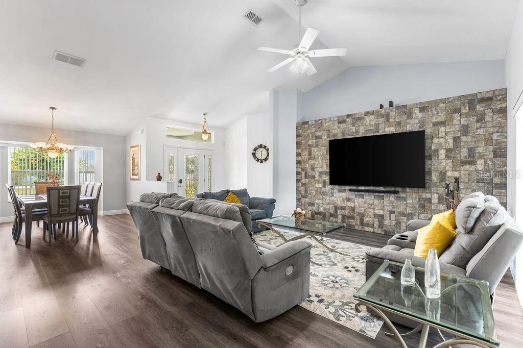 10360 Southwest 48th Avenue Ocala, FL 34476 - Photo 24 of 25 a living room with furniture and a flat screen tv