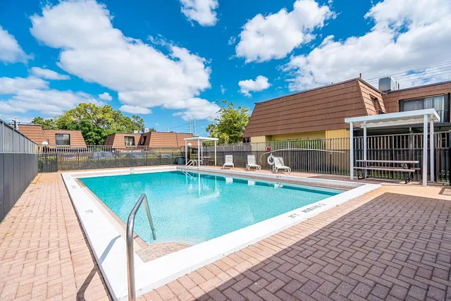 a view of a swimming pool with a lounge chairs