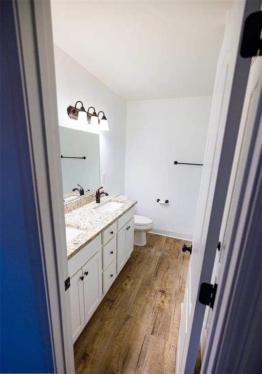 4110 Doubletree Court Cumming, GA 30040 - Photo 11 of 37 a bathroom with a granite countertop sink and a mirror