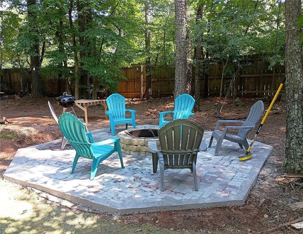 4110 Doubletree Court Cumming, GA 30040 - Photo 18 of 37 a view of a chairs and bench in the backyard