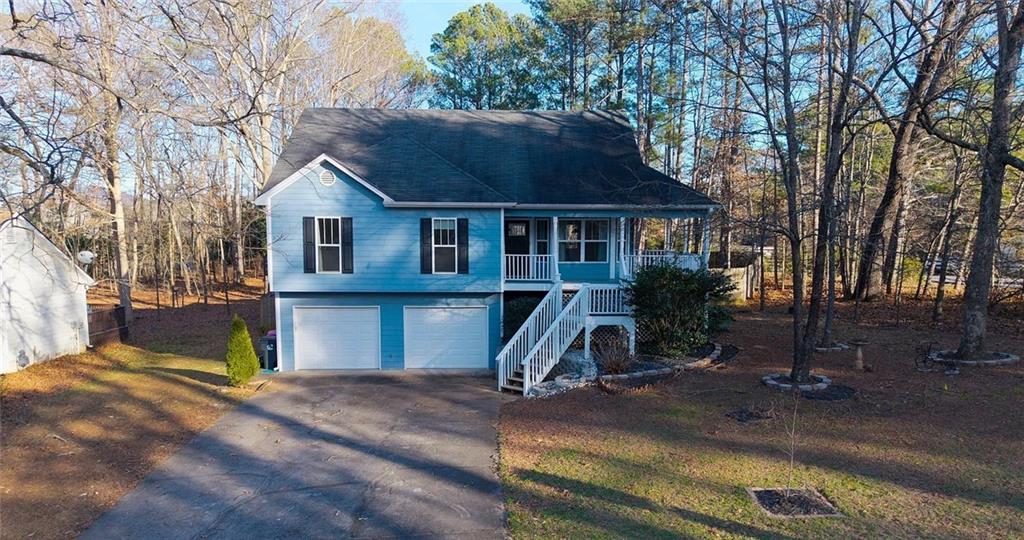 4110 Doubletree Court Cumming, GA 30040 - Photo 2 of 37 a view of a house with a yard