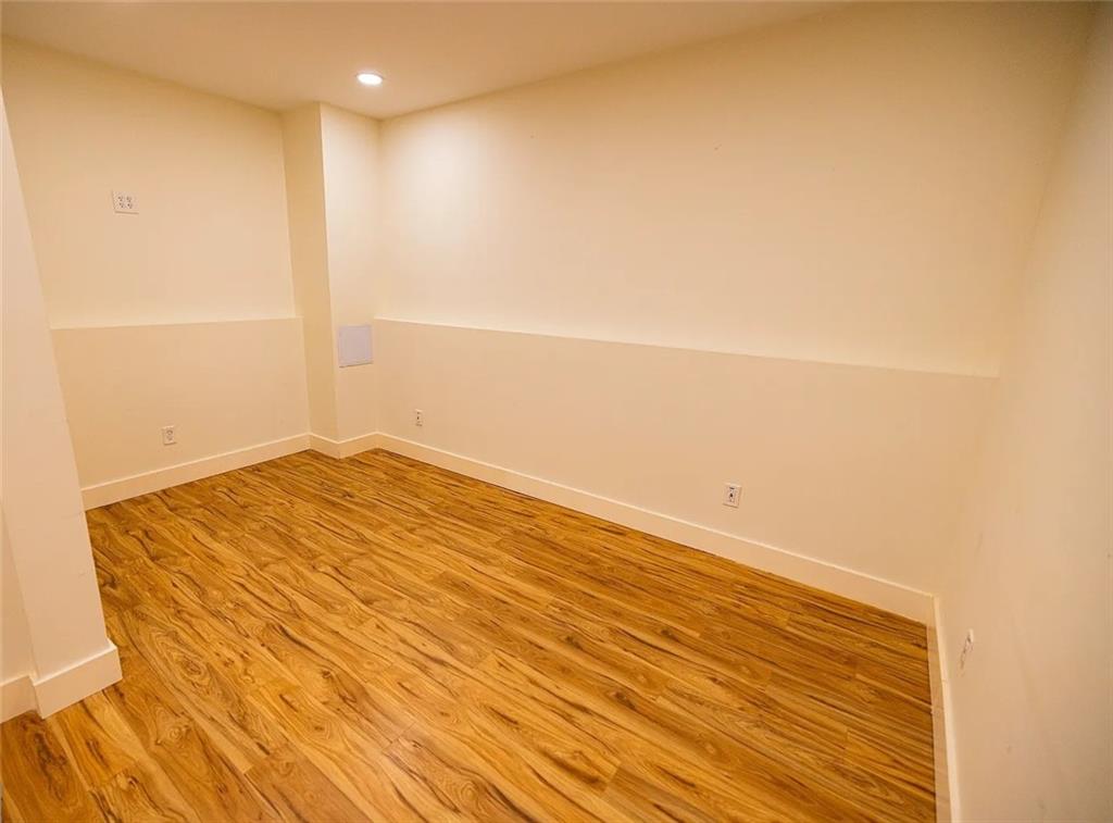 4110 Doubletree Court Cumming, GA 30040 - Photo 26 of 37 a view of empty room with wooden floor