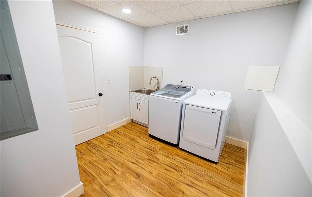 4110 Doubletree Court Cumming, GA 30040 - Photo 28 of 37 a utility room with dryer and washer