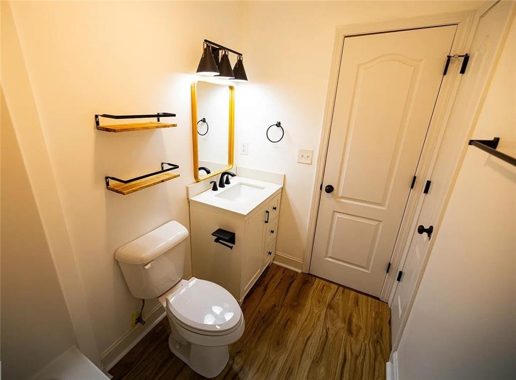 4110 Doubletree Court Cumming, GA 30040 - Photo 30 of 37 a white toilet sitting next to a bathroom sink
