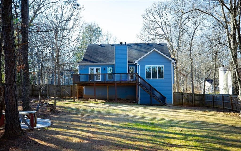 4110 Doubletree Court Cumming, GA 30040 - Photo 3 of 37 a view of a house with a large tree