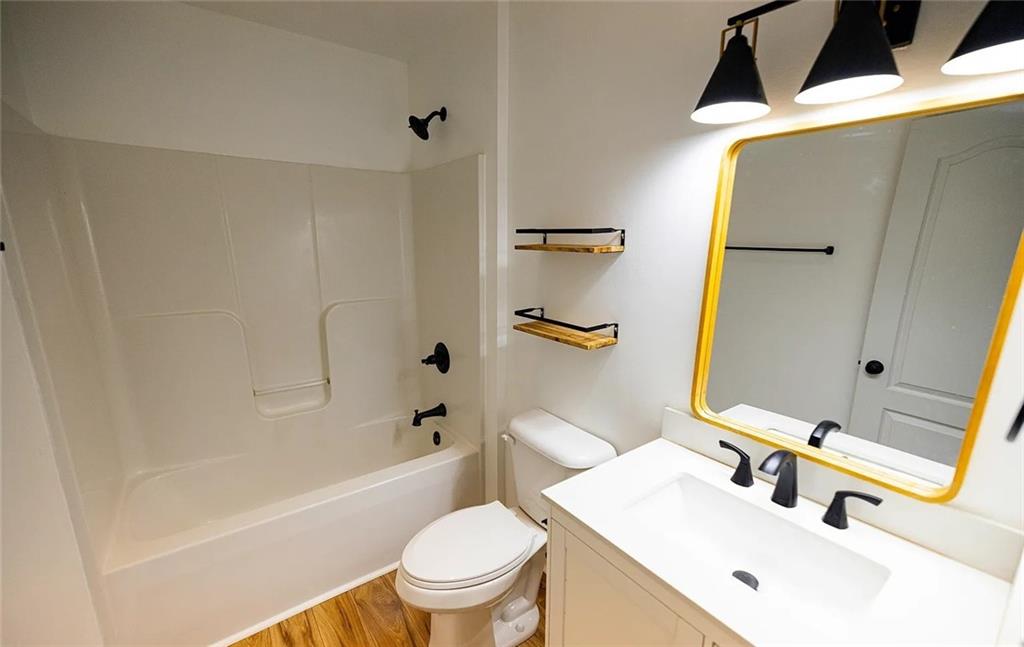 4110 Doubletree Court Cumming, GA 30040 - Photo 31 of 37 a bathroom with a sink toilet and shower