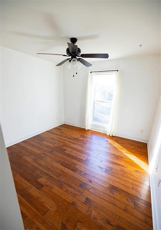 4110 Doubletree Court Cumming, GA 30040 - Photo 35 of 37 a view of empty room with wooden floor