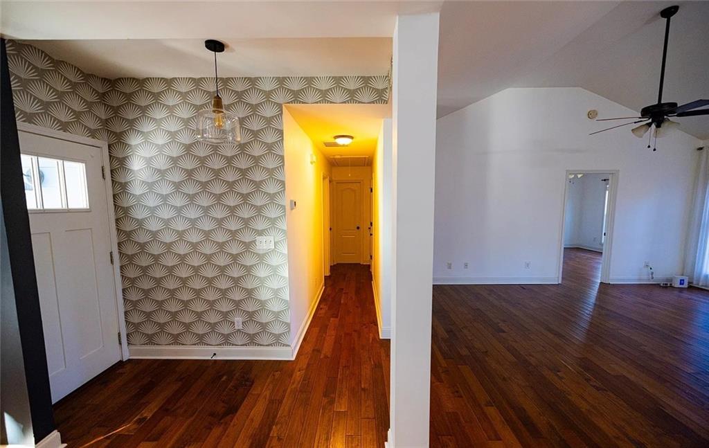 4110 Doubletree Court Cumming, GA 30040 - Photo 36 of 37 a view of a hallway with wooden floor and a bathroom