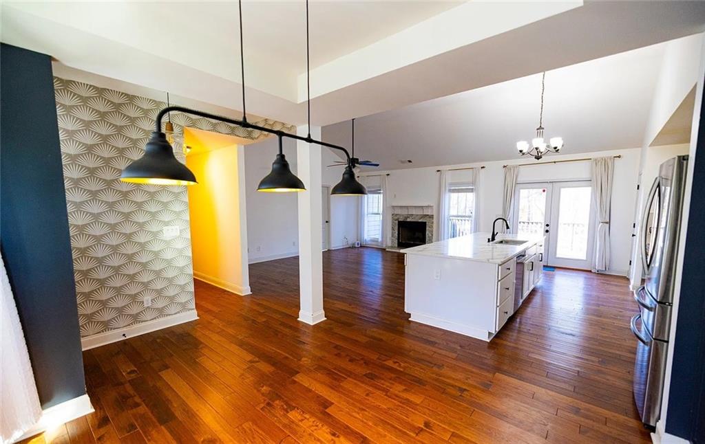 4110 Doubletree Court Cumming, GA 30040 - Photo 7 of 37 a living room with furniture and a wooden floor