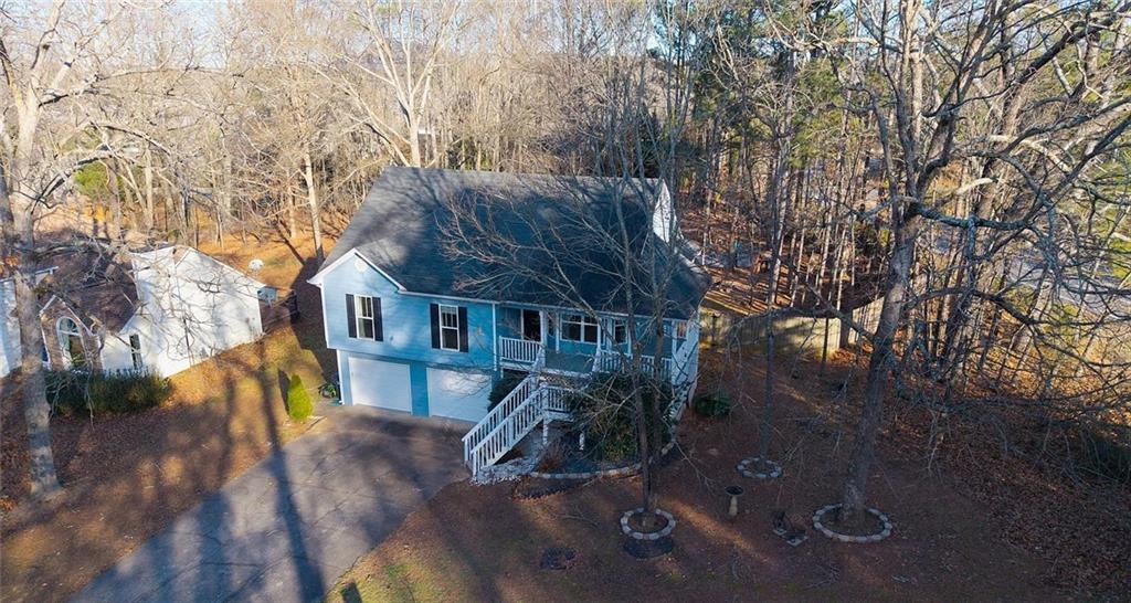 4110 Doubletree Court Cumming, GA 30040 - Photo 8 of 37 a view of a house with a yard