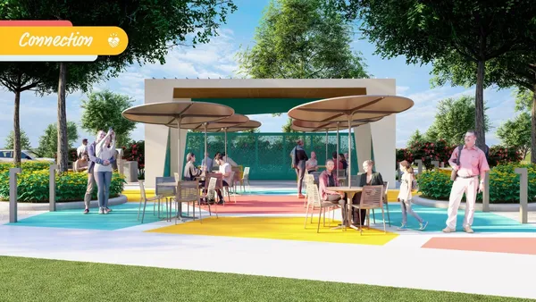 a view of a swimming pool with a table and chairs under an umbrella