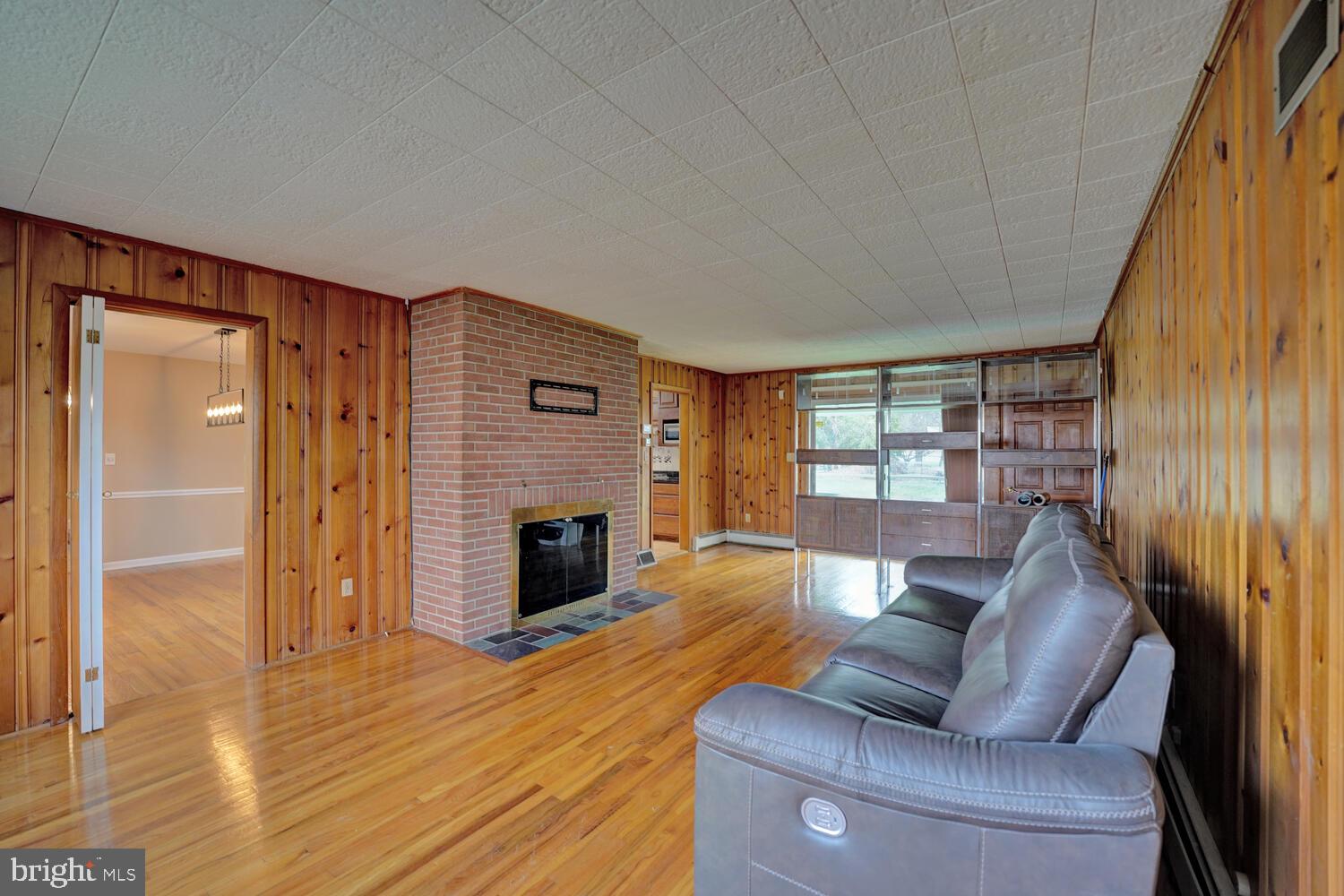 55 Beloit Avenue Dover, DE 19901 - Photo 25 of 54 a living room with furniture and a fireplace