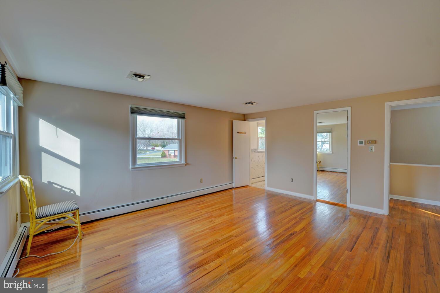 55 Beloit Avenue Dover, DE 19901 - Photo 35 of 54 a view of an empty room with wooden floor and a window