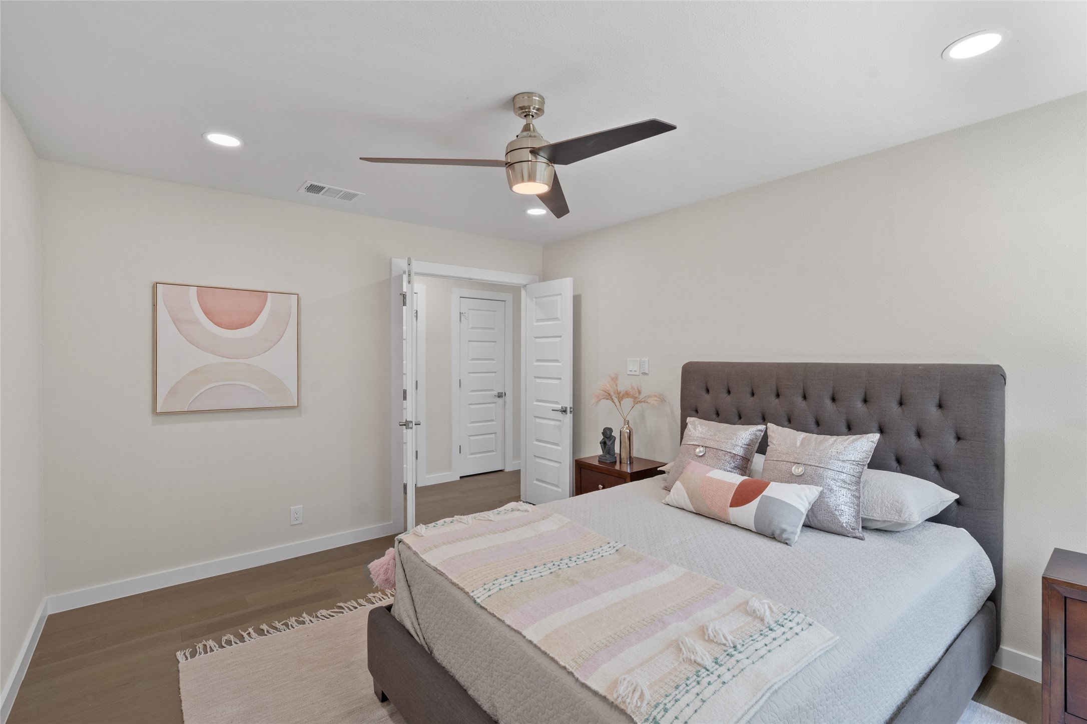 6901 Windrift Way Austin, TX 78745 - Photo 18 of 30 a bedroom with a bed and a ceiling fan