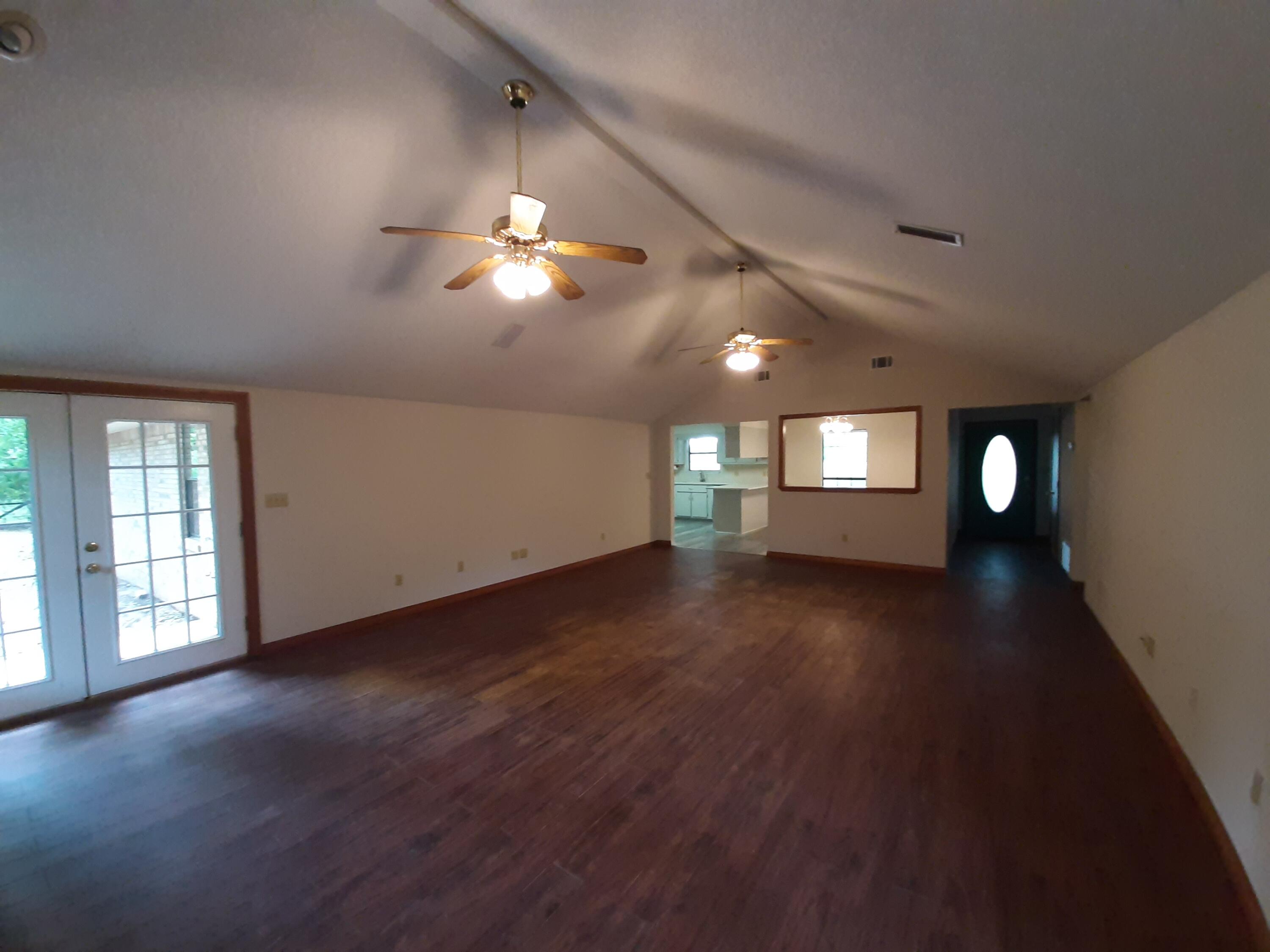 6197 Barnes Road Crestview, FL 32536 - Photo 11 of 35 a view of empty room with wooden floor