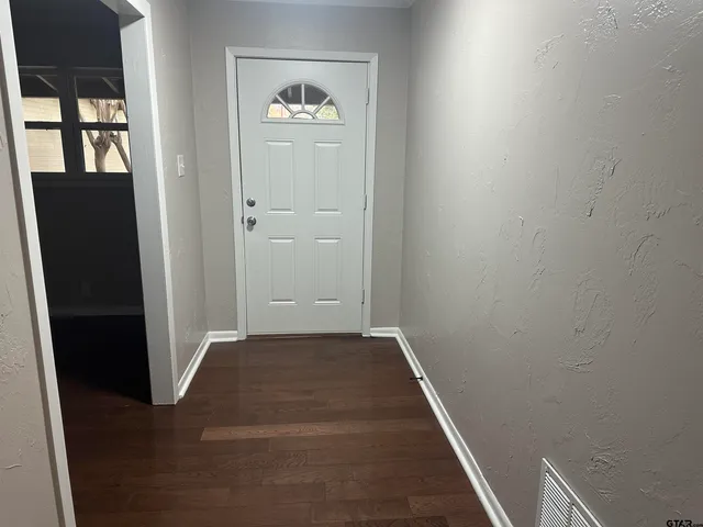 an empty room with windows