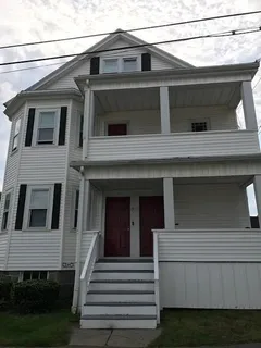 a view of a house with a window and stairs
