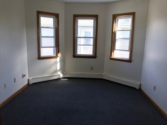 17 Grafton Street, Unit 2 Quincy, MA 02169 - Photo 13 of 25 a view of an empty room with a window
