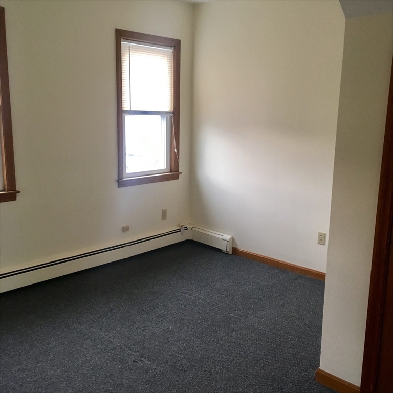 17 Grafton Street, Unit 2 Quincy, MA 02169 - Photo 15 of 25 an empty room with a window